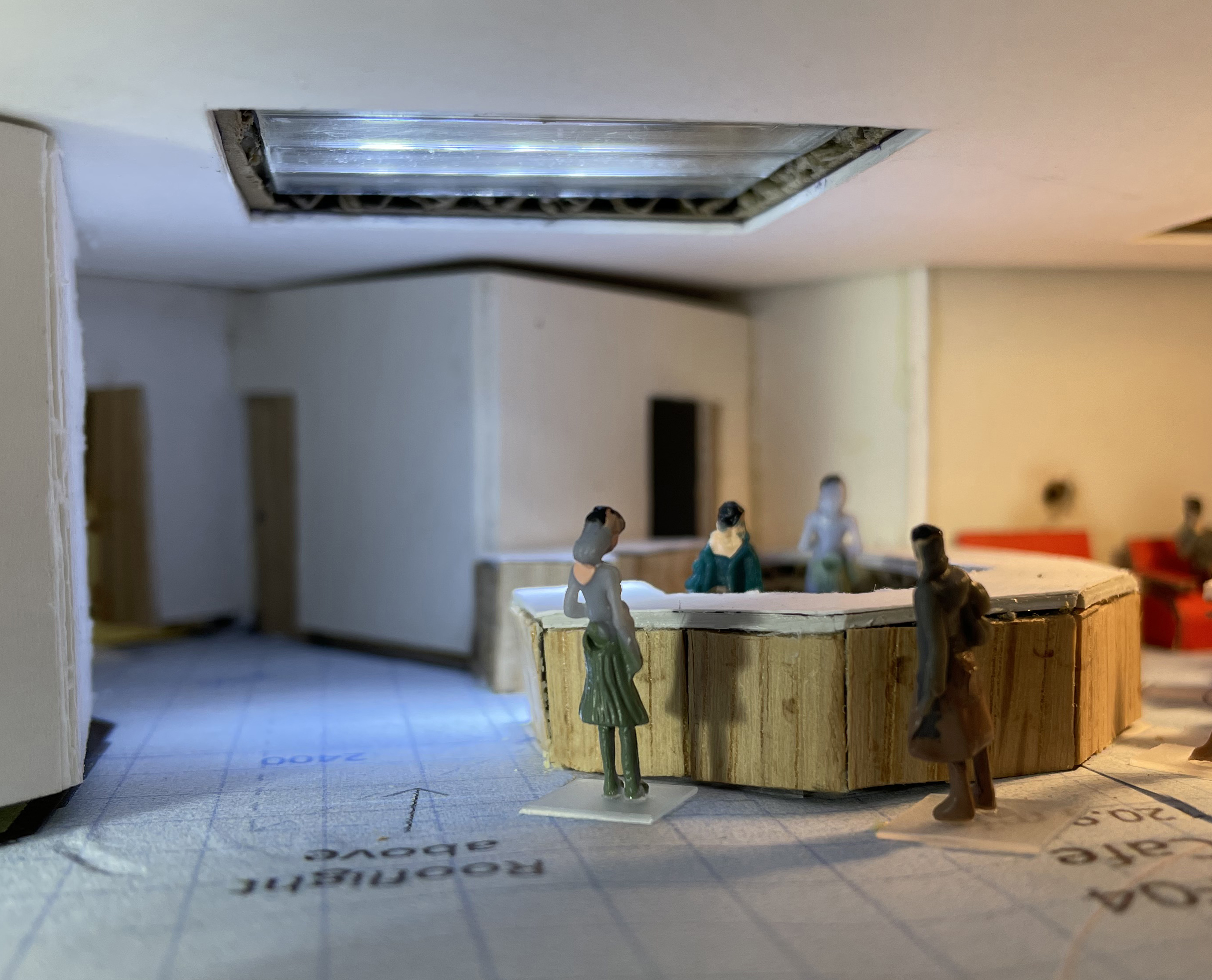 Looking from the new access into/out of church towards the serving counter, with the lounge  on the right (red comfy chairs), the open doorway into the kitchen behind the counter and the corridor with double doors into the hall just visible on the left.